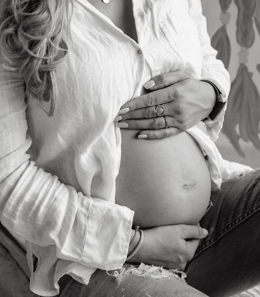 An expectant mother holding her belly